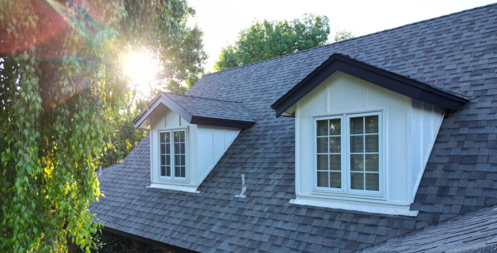 Repainted dormers, fascia and window trim on a North Central Phoenix ranch roofline
